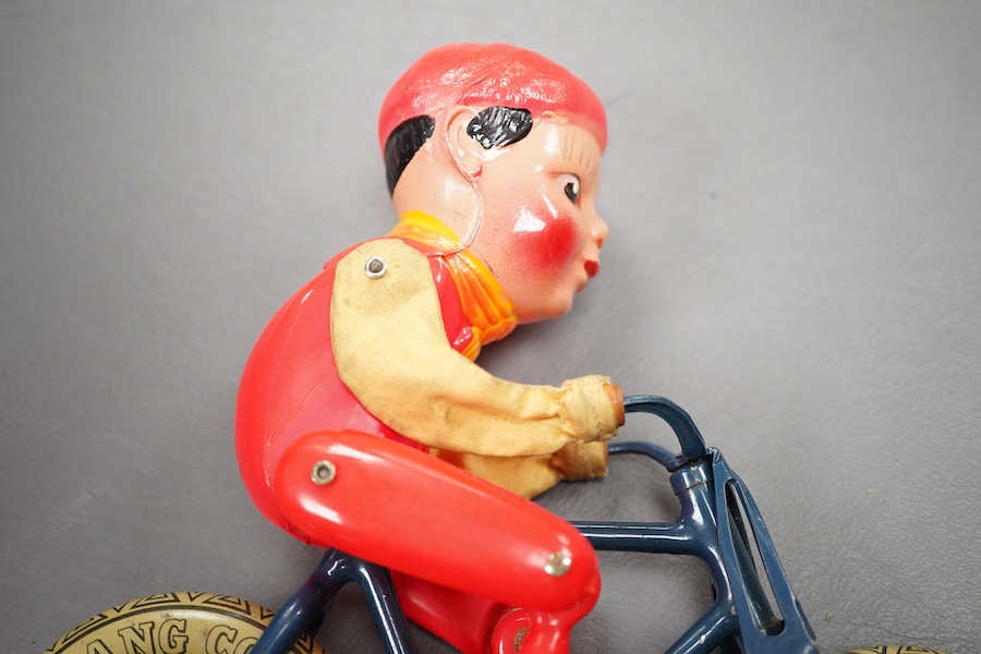 An early boxed Tri-ang Gyro-Cycle, with a gyroscope contained within the front wheel of the bicycle, providing power to the toy, template bicycle with celluloid rider, the box with original inner card holder and a sealed